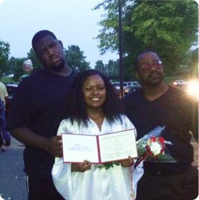 Karelle in graduation gown with her dad(left) and brother(right).